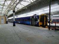 A keek ('peep' to English visitors) through a locked gate to the former Platform 2 at Aberdeen, now used for stabling. There's a foreshortened ex-Platform 1 to the left. Other southern bays 3, 4 and 5 survive and are in regular use. The northern bays once mirrored this profusion but are long gone, with through platforms 6 and 7 doing for Inverness line services. With only a single track as far as Dyce (for now?) this is all it needs.<br><br>[David Panton 28/09/2016]