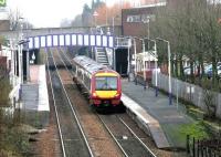 An SPT liveried DMU leaves Falkirk Grahamston westbound with a train for Glasgow Queen Street via Cumbernauld on New Year's Eve 2004.<br><br>[John Furnevel 31/12/2004]