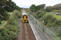 Arriva 158832 slows for the request stop at Talybont on the Cambrian Coast between Harlech and Barmouth. The train is the 1338 from Pwilhelli, one hour into its journey. At Machynlleth it will combine with another service from Aberystwyth to go forward to Birmingham International (arr 1848).<br><br>[Mark Bartlett 19/09/2016]