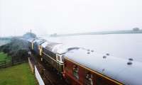 Triple header at Boness... On a dim summer's day the diesel exhaust fumes add to the misty atmosphere. There was 25235 in BR blue leading with D5351 in green at the rear. Could it have been 27001 in the middle?<br><br>[Charlie Niven //1992]