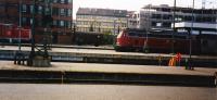 There seemed to be a few interesting features when the Paris-Prague train stopped here. On the right was a DB Class 218 diesel hydraulic loco waiting at the platform with a passenger train. In the left background was a Class V60 shunter and a goods wagon in the centre background seemed to be sitting on a track at platform level.<br>
In the foreground there were some pieces of equipment which looked like large microphones set up between the platforms. Maybe they were checking noise levels?<br><br>[Charlie Niven 08/09/1992]