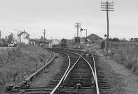 Looking west from Waterford Road level crossing to Forres (formerly East) signal box with the original main line, later goods loop, diverging to the right.  The new station is to be built on this alignment. 1991.<br><br>[Bill Roberton //1991]