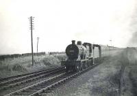 Class 2P 4-4-0 40664 approaching Dalrymple on 15 August 1959 with a Glasgow - Girvan train.<br><br>[G H Robin collection by courtesy of the Mitchell Library, Glasgow 15/08/1959]