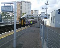 It's 15:12:26 on 08/10/2016 and the head of a 6-car service from the West Highland Line makes it's last stop before Glasgow Queen Street. For some reason this was shown as just 'Glasgow' on the CIS, so someone has gone to the trouble of removing the suffix - to cater for diversions?<br><br>[David Panton 08/10/2016]