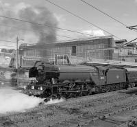 <h4><a href='/locations/C/Carlisle'>Carlisle</a></h4><p><small><a href='/companies/C/Caledonian_Railway'>Caledonian Railway</a></small></p><p>Having brought in The Waverley special from York via Hexham on Sunday 11th September, 60103 Flying Scotsman sat in platform 1 at Carlisle for well over half an hour, giving ample opportunity for photography. Here it is moving forward with the support coach prior to reversing down to Upperby to turn. 92/132</p><p>11/09/2016<br><small><a href='/contributors/Bill_Jamieson'>Bill Jamieson</a></small></p>