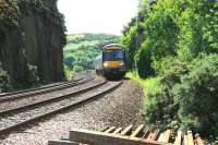 A mid morning ScotRail service bound for Cowdenbeath runs through the rock cutting shortly after leaving the Forth Bridge in June 2006. After passing the camera position the train will then cross Jamestown Viaduct [see image 9752].<br><br>[John Furnevel 20/06/2006]