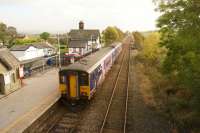 Once a junction but on a smaller scale than its southerly namesake, Clapham in North Yorkshire is rather quieter and in a more rural setting. A Northern DMU is seen departing with a Morecambe to Leeds service in October 2014.<br><br>[John McIntyre 16/10/2014]