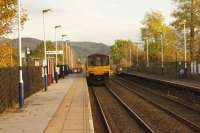 With the autumn colours appearing in the trees a Northern service from Morecambe to Leeds departing from Giggleswick towards Settle Jct late in the afternoon of 16 October 2014.<br><br>[John McIntyre 16/10/2014]