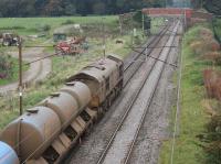 The inner cabs of locos engaged on Rail Head Treatment trains clearly take a pounding during the leaf fall season. DRS 66423 heads north through Woodacre with a RHTT train returning to Carlisle on 14th October 2016. <br><br>[Mark Bartlett 14/10/2016]