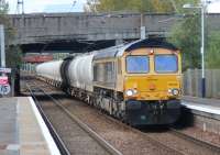 The Fort William to North Blyth Alcan hauled by 66740 passing south through Whifflet station.<br><br>[Alastair McLellan 10/10/2016]