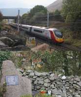 Pendolino 390128 speeds northwards at Tebay on 221016. The train is just passing the poignant memorial to the four railway workers killed here on 15th February 2004 when a poorly maintained trolley ran away on Shap bank during an engineering possession. (Memorial map reference NY613028.)<br><br>[Mark Bartlett 22/10/2016]