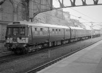 Blue is the colour ... except it's black and white! 303048, repainted in blue livery, stabled at Edinburgh Waverley while engaged on North Berwick branch training runs.<br><br>[Bill Roberton //1991]