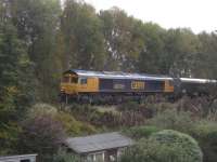 Not the most exciting photo ever taken, but a photo couldn't capture the very impressive sound of GBRf Class 66 No 66701 hammering up the line from Barassie and onto the steep gradient up to Kilmarnock station with a loaded coal train at 1438 hrs on Saturday, 22 October, 2016. These coal trains have always tended to be timed through Kilmarnock to clash with passenger services in and out of the station so the norm is for them to get amber at the distant signal down towards Moorfield and they either slow down or crawl past the old St. Marnocks signalbox site to the outer home signal further up the gradient, where they can be held for anything up to 25 minutes. Being a wee bit later on the day (the Glasgow service departs at 1430hrs) No 66701 obviously got greens all the way so the driver had applied the boot to get some momentum for the climb up to the station.<br><br>[Robert Blane 22/10/2016]