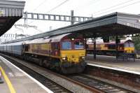 DB Schenker 66132 departing Didcot eastbound with a loaded car train, I assume for Southampton, with 66077 in the background at 1116 hours.<br><br>[Peter Todd 07/10/2016]