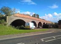 This 12 arch viaduct carried the March to Spalding line through Guyhirn, Cambs. A local builder wanted to demolish it and use the bricks to build houses - shades of Risca [see image 35725]. So far this plan has not come to pass, but neither has the proposal to open a footpath starting here and running SE along the trackbed. In my experience, rail enthusiasts are not welcome at this location - seek your trackbed walks elsewhere! [Ref query 38]<br><br>[Ken Strachan 09/10/2016]
