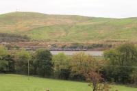 Two TPE 350 EMUs run across a refurbished embankment (one of many between Lancaster and Carlisle) in the Lune Gorge at Dillicar on 22nd October 2016. The M6 Motorway, on two levels at this location, can be seen behind the line.<br><br>[Mark Bartlett 22/10/2016]