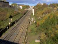 View north of the Cowlairs Incline from Pinkston Road in the afternoon sunshine on 5th November 2016. Foundations for the last few stanchions before the tunnel all appear to be ready for the metalwork to be fitted. Further up the hill the OHLE is at a much more advanced stage. To the right at the top of the photo lies the Sighthill <i>Transformational Regeneration Area</i><br><br>[Colin McDonald 05/11/2016]