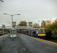 A 170 from Edinburgh sits in arrivals-only Platform 3 to allow a Glasgow to Inverness train to enter. Once the  through lines are  clear the set will run forward then reverse into Platform 1 to return to Edinburgh. Photographed on a dull 26/10/2016.<br><br>[David Panton 26/10/2016]