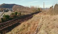 View to Bridge of Earn from an old loading bank at the former Abernethy station in 1996. The two platform station stretched away from the camera and goods yard was behind and to the right. [Ref query 75]<br><br>[Ewan Crawford //1996]