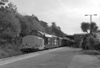 The foliage on the right might suggest this was taken in Cornwall but it's actually Barrow-in-Furness! 37402 awaits departure from platform 3 with the 11:40 to Carlisle, having arrived (slightly early) just over ten minutes previously on the 08:42 from the Border city. The train was well patronised by enthusiasts - mostly grey-haired (I hasten to add I also fall within this category) -  including Railscot contributor David Spaven, who is lurking in the shadows on the right.   21st October 2016<br><br>[Bill Jamieson 21/10/2016]