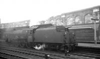 One of Blackpool's batch of Jubilees, no 45584 <I>North West Frontier</I>, stands alongside platform 4 at a misty Carlisle station on 11 July 1964. The locomotive had arrived on the 10.35am summer Saturday working from Blackpool Central, with through coaches for Perth and Edinburgh Princes Street and was awaiting the signal to head for Upperby.<br><br>[K A Gray 11/07/1964]