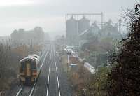 158.734 heads south at Carnoustie in 2005. Golf Street station can be seen in the distance.<br><br>[Ewan Crawford 30/10/2005]