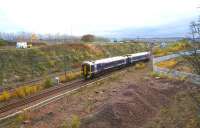 The 0845 Sunday morning ex-Tweedbank approaching Newcraighall South Junction on 6 November 2016. In the background work is well underway on the site of the new EGIP electric train depot, while on the right the Biogen attenuation pool has gained a new fence. [See image 53982]<br><br>[John Furnevel 06/11/2016]