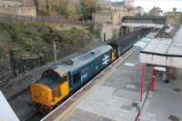 On Saturdays a Class 37 hauled Cumbrian Coast train lays over at Lancaster from 1608 to 1732 before returning to Barrow. 37401 <I>Mary Queen of Scots</I> is seen idling in Platform 5 as the light fades on 5th November 2016<br><br>[Mark Bartlett 05/11/2016]
