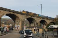 GBRf 66706 <I>Nene Valley</I>, seen passing high above Todmorden's market and bus station, with a Drax to Liverpool biomass empties train on 31st October 2016. <br><br>[Mark Bartlett 31/10/2016]