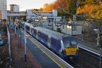 An Edinburgh - Helensburgh train calls at the rather austere but autumnal Dalmuir on 6 November.<br><br>[Bill Roberton 06/11/2016]