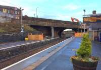 View from platform 1 on 17th November 2016. The access ramp has been partially removed and work continues to relocate sevices on to the temporary pedestrian bridge. The more recent concrete extension part of the bridge is due to be demolished in a few days – the original masonary structure will remain for a bit longer. A programme of late evening and Sunday replacement buses is currently in effect on the line.<br><br>[Colin McDonald 17/11/2016]