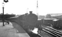 Bright sunshine at Buchanan Street in the summer of 1966 as one of St Rollox shed's Caprotti valve geared standard class 5 4-6-0s,  no 73153, waits to take out an afternoon train for Dundee.<br><br>[K A Gray //1966]