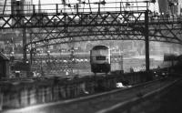 A Class 47 heads towards Aberdeen in this view under the signals from Ferryhill towards the city in April 1977.<br><br>[John McIntyre /04/1977]