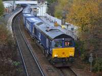 DRS 66425 runs through Inverkeithing with the Inverness - Mossend Tesco train, diverted away from the Stirling route because of engineering work.  20 November.<br><br>[Bill Roberton 20/11/2016]