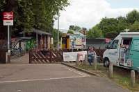 Visitors to Sudbury station in the 1970s rarely bothered about its minimal and decaying passenger facilities. It was miracle enough that there was still a train service. Forty years later, all had changed. The intending traveller was by then greeted with clean premises, floral displays, cycle racks, plenty of information and free newspapers. Temptation was in the form of fresh ground coffee and bacon “sarnies” for £2.50. Very possibly, the table and chairs constitute the first class lounge.<br><br>[Mark Dufton 14/07/2016]