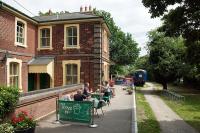 Grub’s up for an eager diner at the former Rayne station on 7th July 2016. Known at the time as the “Booking Hall”, the premises were in use as a café for users of the Flitch Way. The Mk 2 coach was serving as a museum for the original railway line between Bishops Stortford and Braintree.<br><br>[Mark Dufton 07/07/2016]