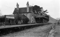 The station at Corfe Castle in March 1977 when it wasn't looking it's best and awaiting some attention. Today the Swanage Railway have done a wonderful job in restoring not only the building but the tracks as well. The castle is hiding behind the station in this view looking north-west.<br><br>[John McIntyre /03/1977]