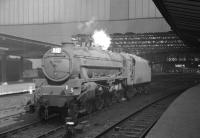 Black 5 44788 stands on the centre road at Carlisle on 27 July 1963 waiting to take forward an arrival from the south. The train in question is the 1X91 summer Saturday relief Llandudno - Glasgow Central. The locomotive is carrying a 65F (Grangemouth) shed plate, presumably having been pressed into service to help out on a busy summer Saturday.<br><br>[K A Gray 27/07/1963]