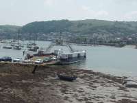 The cable operated <I>Higher Ferry</I> seen from a Kingswear bound train in June 2010. This vessel had only been introduced during the previous year. The vehicles leaving the ferry are queuing for the level crossing at the site of Britannia Crossing Halt.<br><br>[Mark Bartlett 14/06/2010]