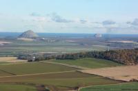 Not a typical railway photo - spot the train. What a view after 132 steps up Garleton Monument near Haddington. North Berwick Law and Bass Rock evident, as well as a toy-town train some couple of miles east of Drem.<br><br>[Bruce McCartney 23/11/2016]