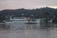 Dusk on Windermere but the cruise boats still ply their trade. <I>MV Swan</I>, built for the LMS Railway in 1938, is seen heading for Lakeside on 26th November 2016. To the right of the bow the cable ferry <I>Mallard</I> can be seen near the east bank [See image 53365]. <br><br>[Mark Bartlett 26/11/2016]