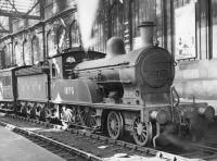 Worsdell LNER D17 4-4-0 no 1876 stands in bay platform 6 at Carlisle in the 1930s with a Newcastle train. (D17/1 no 1621 is preserved at the National Railway Museum)<br><br>[Dougie Squance (Courtesy Bruce McCartney) //]