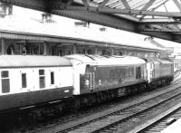 Unusual combination. Photograph taken at Dumfries on a Saturday morning in January 1972. View is south from the steps of the station footbridge, just as a diverted Anglo-Scottish service passes through behind 439+183.   <br><br>[John Furnevel 09/01/1972]