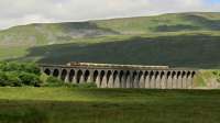 A Settle and Carlisle cement train comes over Ribblehead Viaduct.<br><br>[Ian Dinmore //]