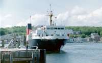 Pioneer, seen here alongside at Rothesay at 11.45 on 19-7-94, was quite distinctive - nothing else like her. She does have a port funnel as well, unlike some of today's bizarre designs!<br>
<br>
'Pioneer' was an extra sailing - all she carried was a gas tanker which could not go by the timetabled ferry for safety reasons.<br>
<br>
As far as traceable, she became MV Brenda Corlett of Corlett Lines when sold by Calmac in 2004, and still operates in the Gulf of Guinea, West Africa. She is now 42 years old.<br><br>[Colin Miller 19/07/1994]