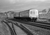 Looking east at Newbiggin with 101 322 passing on an Edinburgh-bound service.  In the foreground is the severed connection to the Alcan (formerly British Aluminium Co.) siding.<br><br>[Bill Roberton //1987]