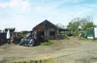 Reedsmouth Junction Shed in 2002. The former line to Riccarton is to the left.<br><br>[Mike Shannon /05/2002]