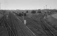 Looking north from Old Craighall Road in 1987 with the former Waverley Route running through Millerhill Marshalling Yard and the ECML chord and wagon repair shops to the right. The slow lines were being used for stabling.<br><br>[Bill Roberton //1987]