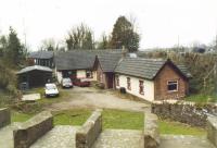 Kirkandrews was the first station out of Carlisle on the way to Port Carlisle or Silloth. This 2002 view looks away from Carlisle and shows the station converted to a house. [Ref query 204]<br><br>[Mike Shannon /03/2002]