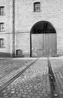 Looking across Anderson Place, Bonnington to a closed bonded warehouse since converted to flats, with a spur from Bonnington Goods Yard running across the road.<br><br>[Bill Roberton //1987]